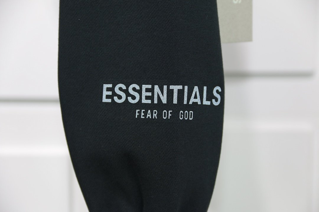 fear of god essentials pullover hoodie applique logo